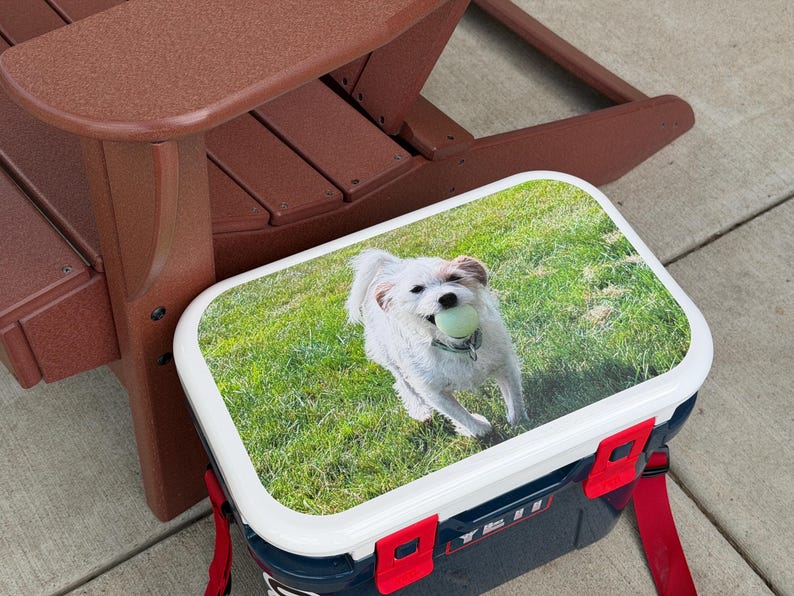 Custom cooler lid decal installed on navy blue cooler